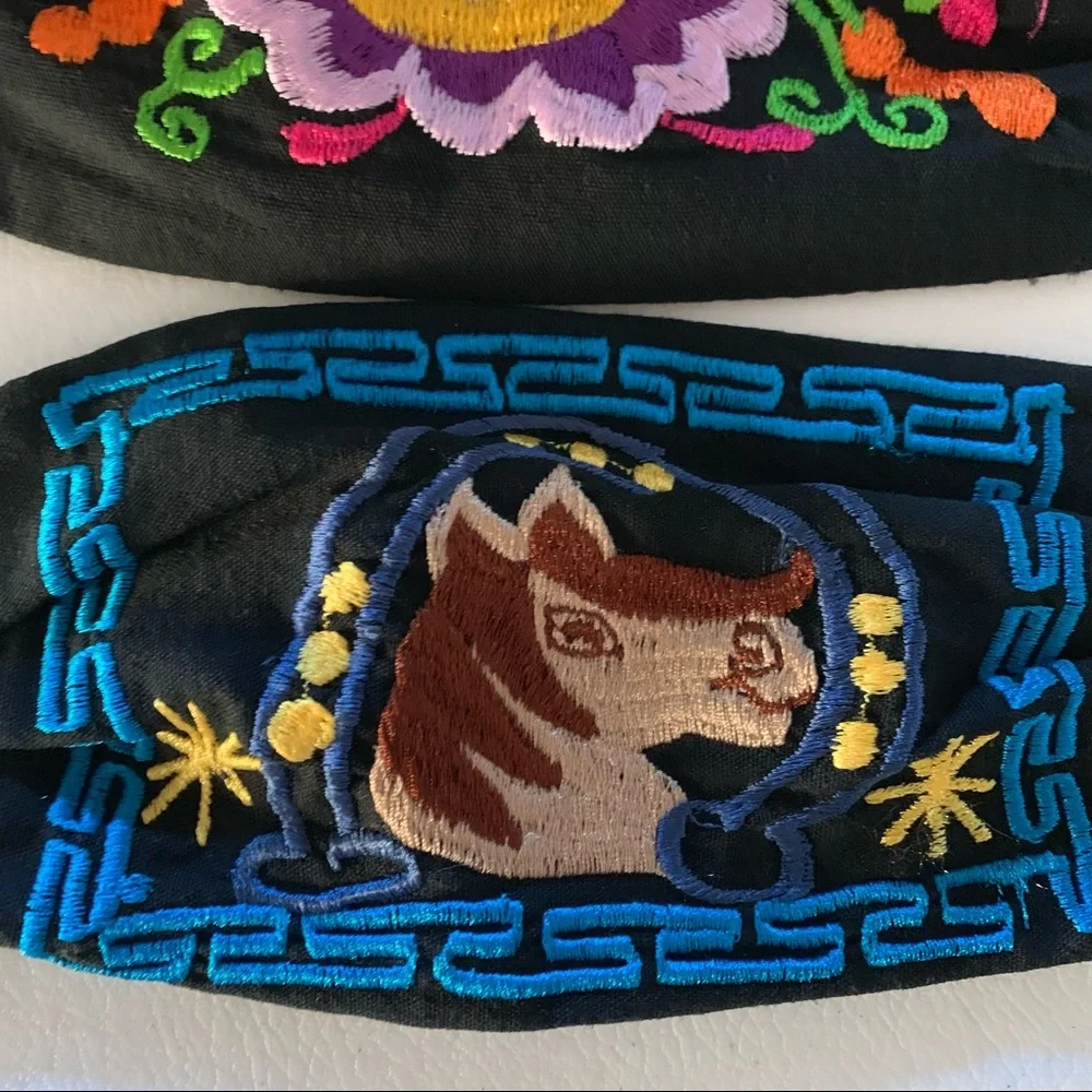 Two embroidered face masks